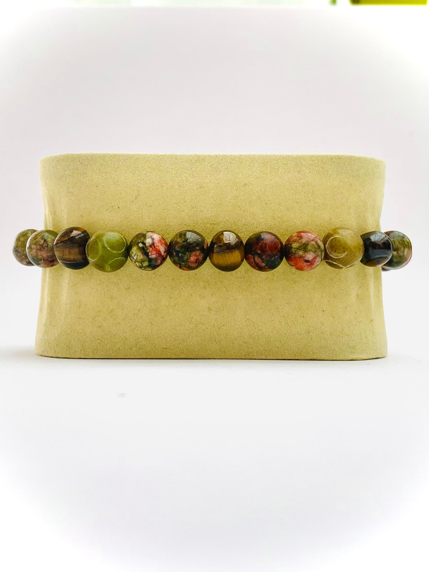 Pulsera unakita, ojo de tigre y jade tibetano